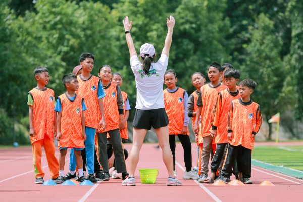 Volunteers coaching kids in Indonesia